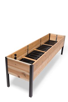 a wooden bed frame with black metal straps