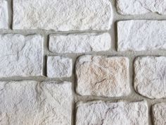 a close up view of a white brick wall