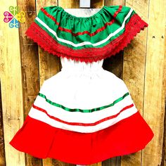 Traditional children Campesino dress, fresh and comfortable design with elastic around the waist. Made with white 'popelina' and decorated with silk and cotton lace. Perfect for 5 de Mayo or Independence day! Let your children wear their price from the Mexican culture:) Check out additional styles at GuelaguetzaDesigns.com Size Bust(around)Length 0-6Mo 60 cm/ 24 in38 cm/ 15 in 1T 70 cm/ 27 in46 cm/ 18 in 2T 80 cm/ 31 in 52 cm/ 20 in 4y 85 cm/ 33 in60 cm/ 24 in 6y 90 cm/ 35 in70 cm/ 27 in Need mo White Ribbon Dress For Dress-up, White Dress With Ribbon For Dress-up, Multicolor Cotton Holiday Dress, Multicolor Cotton Dress For Holiday, Holiday Multicolor Cotton Dress, Short Sleeve Patchwork Dress For Dress-up, Green Ruffled Dress For Holiday, Cute Green Dresses For Holiday, Green Cotton Holiday Dress