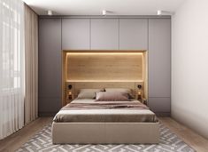 a bedroom with a large bed and wooden headboard on top of it's sides