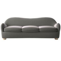 a gray couch sitting on top of a white floor