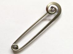 a metal handle on a white surface