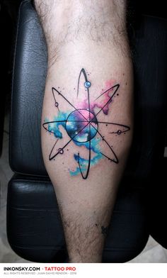 a man's leg with a tattoo on it and an image of a star in the center