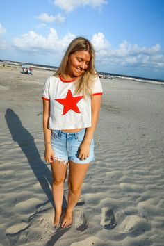 Summer Cotton T-shirt With Star Patch, Crew Neck Tops With Star Logo For Summer, Casual Summer Tops With Star Logo, Cotton T-shirt With Star Patch For Summer, Cotton Crew Neck Top With Star Patch, White Summer T-shirt With Star Patch, Red Star Print Top For Summer, White Summer Tops With Star Logo, Red Short Sleeve Top With Star Print