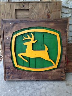 a wooden sign with a deer on it