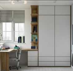 a room with a desk, bookshelf and chair in it next to a window