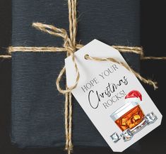 a gift wrapped in blue paper with a tag that says, hope your christmas rocks