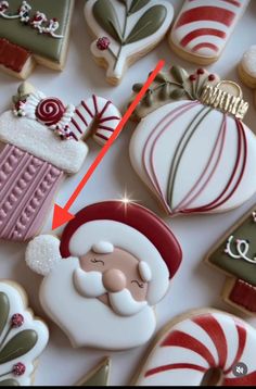 an image of christmas cookies with santa clause on them