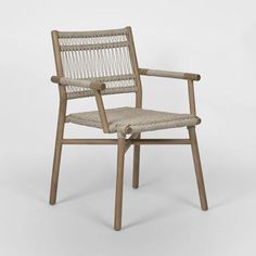 the chair is made out of wood and has a woven seat pad on it's back