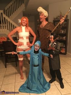 three people dressed up in costumes standing next to each other