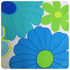 blue and green flowers on white fabric