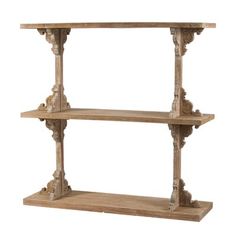 an old wooden shelf with carvings on the top and two shelves below it, all made out of wood