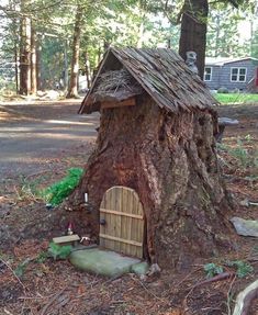 a tree stump with a house built into it