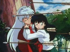 an anime scene with two people hugging each other