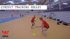 two girls in red shirts and black shorts playing with yellow cones on an indoor court