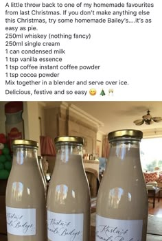 three bottles of chocolate milk sitting on top of a table