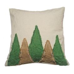 a green and beige pillow with trees on it