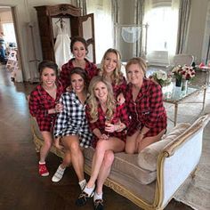 the bridesmaids are posing in their matching red and black flannel shirts