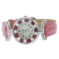 This elegant Murano Glass watch is a unique timepiece featuring high-quality workmanship and Murano's most famous glass-making technique called Millefiori. Exquisite mosaic flowers in rich summer colors adorn the handcrafted face of this watch for a stylish Venetian look that will leave everyone impressed. The beautiful and unique Murano watch adds a fine Venetian accent to any outfit and works equally well for your casual day or a dress-up evening. The face of this Murano glass watch measures 1 Elegant Multicolor Watches As Gifts, Elegant Multicolor Watches For Gifts, Multicolor Watches With Diamond Hour Markers And Round Dial, Multicolor Watch With Diamond Hour Markers, Elegant Multicolor Round Dial Watches, Multicolor Watches With Diamond Hour Markers, Unique Murano Glass Necklaces As Gifts, Rich Summer, Handmade Traditional Murano Glass Jewelry