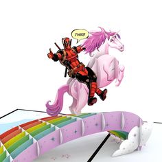 a paper model of a person riding a horse on a rainbow colored bridge with unicorns