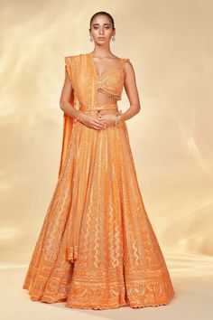 Nitika Gujral | Orange Net Embroidered Lehenga Set | INDIASPOPUP.COM Designer Orange Lehenga With Intricate Embroidery, Designer Orange Lehenga With Mirror Work, Designer Wear Orange Lehenga With Mirror Work, Orange Lehenga With Mirror Work For Wedding, Orange Wedding Choli With Mirror Work, Wedding Orange Choli With Mirror Work, Orange Mirror Work Dupatta For Reception, Designer Orange Choli With Intricate Embroidery, Designer Wear Orange Choli With Intricate Embroidery