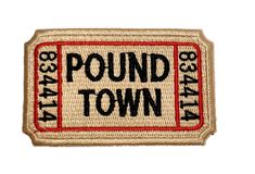 a patch with the words pound town in black and red on it, which reads