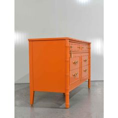 We have a charming 1970s Hollywood Regency Faux Bamboo Dresser by Thomasville in Orange, newly painted to add a fresh, modern twist to its vintage charm. Crafted with faux bamboo detailing, this dresser features 6 drawers. The credenza is adorned with pretty brass hardware that perfectly complements the color orange, creating a look that is both timeless and unique.  Color: Behr Electric Orange  DIMENSIONS  W49.75 d19 h 30 in  CONDITION NOTES  In excellent condition. Newly refurbished. Fully det Orange Dresser, Faux Bamboo Dresser, Bamboo Dresser, 1970s Hollywood, The Color Orange, Electric Orange, Faux Bamboo, Hollywood Regency, Brass Hardware