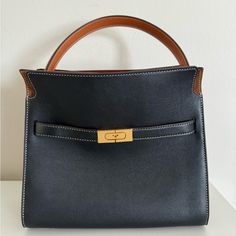 Tory Burch Lee Radziwill Small Leather Double Bag Black/Suede Brown In Perfect Condition, Comes With Dust Bag And Strap. No Scratches Or Marks Measurements: 10.76w X 9.56h X 4.78d Lined Leather Petite Lee Radziwill Double Bag, Tory Burch Lee Radziwill Petite Double Bag, Leather Handbags Women Tory Burch, Leather Crossbody Bag Tory Burch, Lee Radziwill, Black Shoulder Bag With Gold-tone Hardware And Double Handle, Tory Burch Bag, Black Suede, Tory Burch