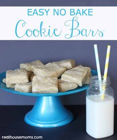 easy no bake cookie bars on a blue cake plate with a glass of milk