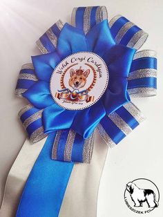 a blue and white ribbon with a dog's head on it