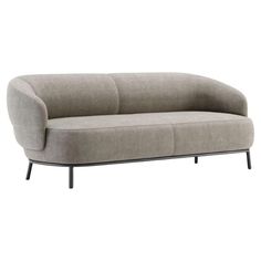 a gray couch with black legs on a white background