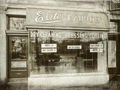 an old photo of a store front with signs on the door and windows that say,'dry cleaning - pressing - dying '