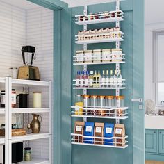 a kitchen with blue walls and white shelving