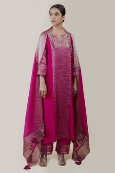 Pink A-line kurta in chanderi silk and striped chanderi tissue base with panels and aari hand embroidery. Comes with cotton slub silk pant, a slip, and a soft organza dupatta having zari work and handmade tassels.
Component: 4
Pattern: Hand embroidered
Type Of Work: Aari
Neckline: Notched
Sleeve Type: Three quarter
Fabric: Kurta : Chanderi silk, Striped chanderi tissue, Pant : Cotton slub silk, Dupatta : Soft organza
Color: Pink
Other Details: 
Embroidered neckline and cuffs
Side slits
Occasion: Pink Kurta, Silk Pant, A Line Kurta, Zari Work, Organza Dupatta, Embroidered Neckline, Silk Dupatta, Silk Pants, Fashion App