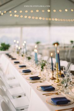 the table is set with blue and gold place settings