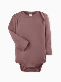 Buttery soft and versatile, our organic long sleeve bodysuit is an essential piece for any growing baby. Made of 100% organic cotton Interlock fabric Nickel-free snaps Water-based dyes ensuring long-lasting color vibrancy and durability Sustainably sourced and ethically produced Naturally hypoallergenic Cotton Long Sleeve Onesie For Fall, Casual Long Sleeve Soft Onesie, Long Sleeve Solid Cotton Bodysuit, Solid Cotton Long Sleeve Bodysuit, Solid Long Sleeve Cotton Bodysuit, Fall Cotton Long Sleeve Bodysuit, Fitted Organic Cotton Long Sleeve Onesie, Fitted Long Sleeve Organic Cotton Onesie, Organic Cotton Long Sleeve Onesie For Spring