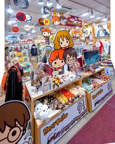 a store filled with lots of toys and merchandise on display in front of people looking at them