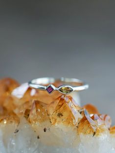 Two colors collide in this dainty citrine and ruby ring. Each piece of our jewelry is handcrafted with love. Yellow Sterling Silver Birthstone Ring, Yellow Birthstone Ring In Sterling Silver, Yellow Multi-stone Sterling Silver Rings, Ethical Jewelry, Ruby Ring, Birthstone Jewelry, Jewelry Branding, Citrine, Birthstone