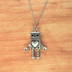 "♥ Silver Robot Charm Necklace Robot Necklace Robot Gift Engineer Gift Birthday Gift Christmas Gift Personalized Gift ♥ You will receive 1 necklace ♥ Robot charm 29(11/8\")x 20(6/8) mm ♥ Stainless steel chain 18 inches ♥ We strive for next day shipping, but we do not ship on Saturdays, Sundays, and Holidays. It may sometimes take a bit longer when we have unusually large volume of orders. Thank you for your patience! ♥♥ For more details on shipping guideline and other policies, please read polic Robot Necklace, Robot Gift, Mexican Sugar Skull, Personalised Bangle, Engineering Gifts, Mother Christmas Gifts, Valentines Necklace, Charm Bangle, Personalized Christmas Gifts