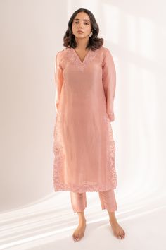 Light pink kurta crafted in upada silk with flared sleeves and resham cutwork embroidery on the neckline, sleeves, front slits.
Components: 2
Pattern: Embroidered
Type Of Work: Resham
Neckline: V Neck
Sleeve Type: Flared
Fabric: Upada Silk
Color: Pink
Other Details: 
Length:
Kurta: 44 inches
Pant: 36 inches
Closure:
Pant: Elastic band in the back
Occasion: Puja - Aza Fashions Elegant Chanderi Pants With Resham Embroidery, Pink Pants For Wedding Eid Festival, Silk Pants With Chikankari Embroidery For Festive Occasions, Chanderi Pants For Wedding And Eid, Pink Chikankari Embroidery Pants For Eid, Semi-stitched Pink Tussar Silk Kurta, Elegant Pink Pants For Eid, Pink Unstitched Tussar Silk Kurta, Unstitched Pink Tussar Silk Kurta