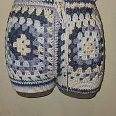 there is a crocheted blue and white shorts on display