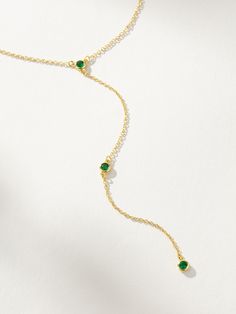 Everyone’s going to be envious that you have this lariat necklace. Crafted with a dainty chain necklace and green gemstones, this is the ultimate layering necklace. Pair the Envious Lariat Necklace with any of our chain necklaces for a stack that gives you some length and instantly makes people look. Want more Y-shaped necklaces? Shop all of our lariat necklaces now. Elegant Adjustable Green Lariat Necklace, Green Lariat Jewelry With Adjustable Chain, Green Lariat Necklace For Gift, Green Jewelry With Delicate Chain For Layering, Elegant Green Lariat Necklace As Gift, Green Lariat Necklace For Gifting, Green Minimalist Chain Necklace With Adjustable Chain, Green Dainty Clavicle Chain Necklace, Green Dainty Chain Necklace