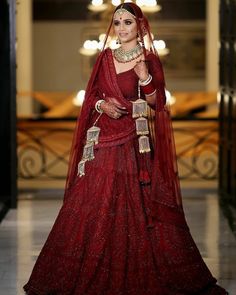 a woman in a red bridal gown