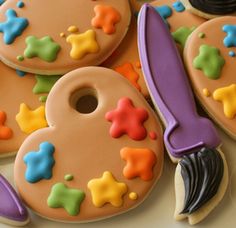 decorated cookies with scissors and stars on them