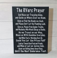 a sign that says the river's prayer is posted in front of a white wall