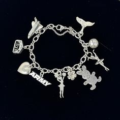 "🌼 James Avery 925 sterling silver charm bracelet with 10 charms, 4 are marked Avery charms, the other 6 are sterling silver charms and the chain bracelet with safety chain is marked Avery.  Charms are 925 whale tail Avery volleyball  925 ballerina  925 rabbit  flower Avery cheerleader Avery Army 925 puffy heart 925 nativity Avery space shuttle. 🌼 Measures: 6\".  My wrist is 6\" and it just fits. 🌼 Condition: overall very good, the top wing on the space shuttle is slightly bent. Please see al Sterling Silver Charm Bracelet With Removable Dangle Charms, Sterling Silver Charm Bracelet With Removable Charms, Sterling Silver Dangle Charm Bracelet With Removable Charms, Silver Sterling Charm Bracelet With Dangling Charms, Silver Sterling Silver Charms With Removable Feature, Sterling Silver Charms With Removable Feature, Removable Sterling Silver Charms In Silver, Sterling Silver Bracelet With Dangling Charms, Hypoallergenic Dangle Charm Bracelet In Sterling Silver