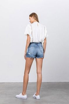 Button-Down Mid-Rise Denim Shorts Upgrade your summer wardrobe with our button-down mid-rise denim shorts. The classic denim look with a modern twist offers both style and comfort. Style: Casual Print/Pattern: Medium wash Denim Silhouette: Shorts Fit: Mid Rise - Regular Embellishment: Distressed edged Neck Line: N/A Sleeve: N/A Length: No Closure: Button Closure Lining: No Made In: CHINA Fabric Contents: 98% COTTON, 2% SPANDEX Stretch fabric Non-sheer fabric Care Instructions: Machine Wash Cold Farm Clothes, Shorts Fit, Ripped Denim Shorts, Mid Rise Shorts, Sleeveless Bodysuit, Mini Shorts, Ripped Denim, Floral Dress Black, Print Pattern