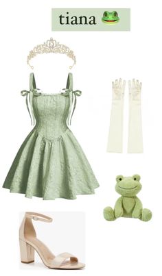 a green dress and white gloves with a frog on the floor next to it is an image of a tiara