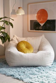 a white dog bed sitting on top of a blue rug