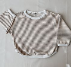 Oversized Contrast Stripes Tops For Loungewear, Oversized Striped Tops For Loungewear, Oversized Striped Top For Layering, Oversized Tops With Contrast Stripes For Layering, Striped Relaxed Fit Sweater For Loungewear, Striped Ribbed Top With Relaxed Fit, Striped Cotton Sweater For Loungewear, Oversized Striped Cotton Sweater, Striped Oversized Top For Layering